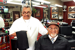 Raul Gonzales, left, and Thomas Curley, right, at Curley's Family Barbershop. photo: Jimi Giannatti