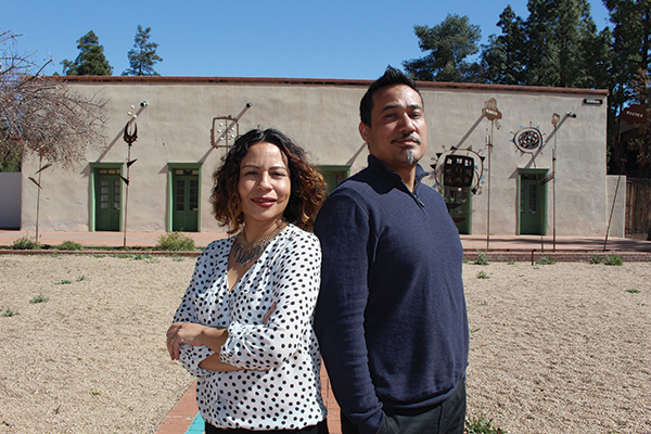 Borderlands Theater Marketing and Outreach Director Milta Ortiz (left) with Producing Director Marc Pinate (right) in front of the theater’s new office/community space, the Sosa-Carrillo-Fremont House museum, at 151 S. Granada Ave. Photo by Gaby Hurtado